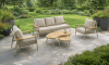 Sevilla loungeset met beige kussens in tuin