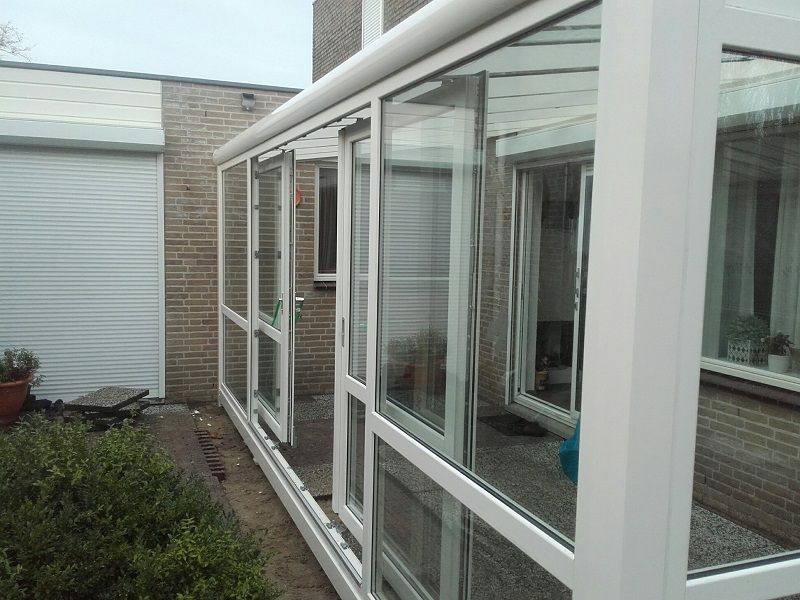 Aluminium veranda met glasschuifdeuren - Alphen aan de Rijn